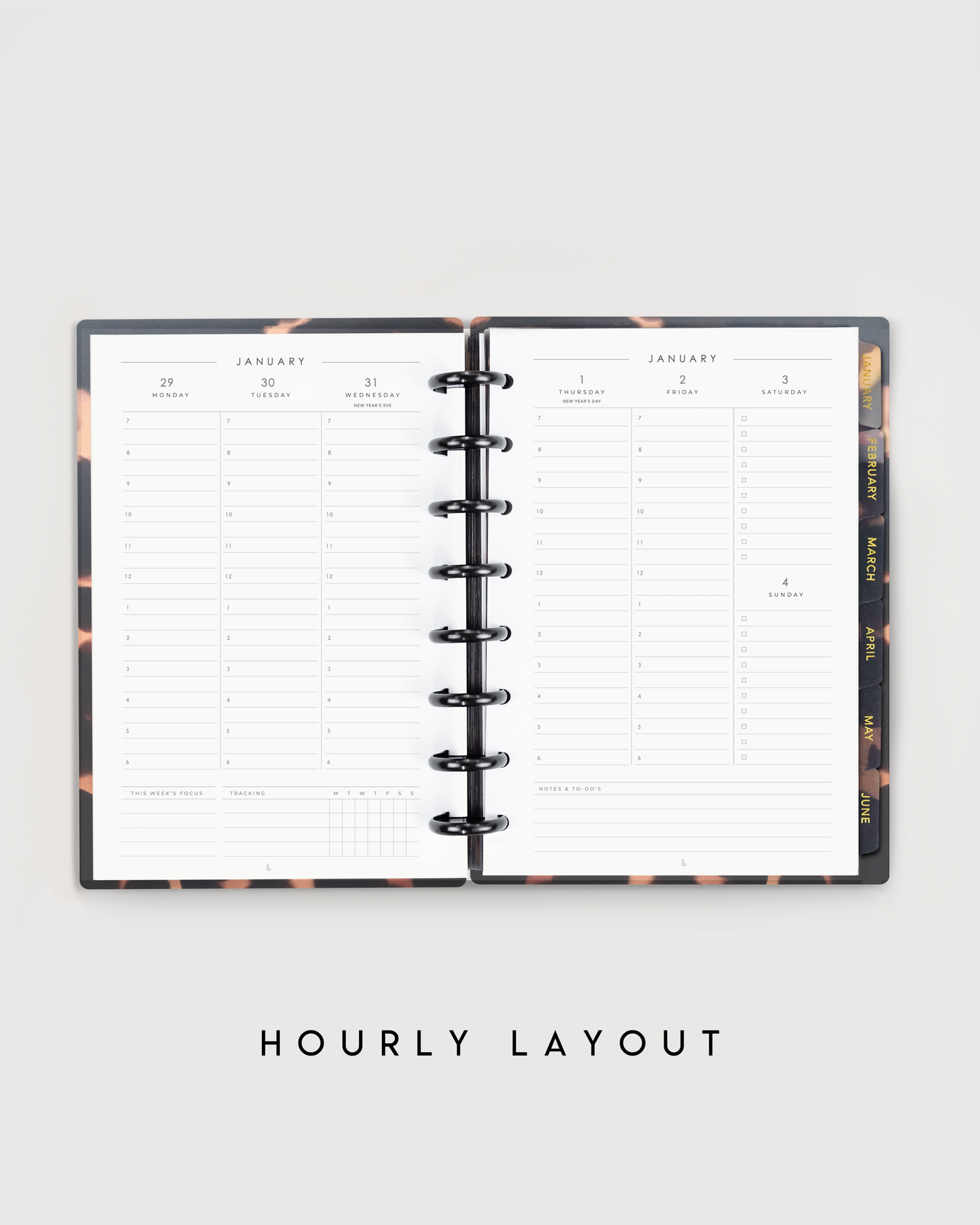 Open planner with hourly layout on a light gray background