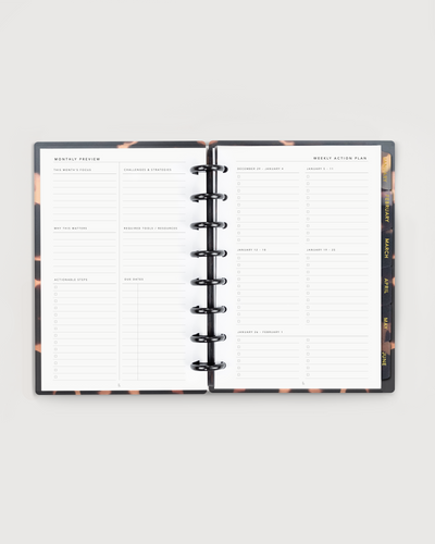 Open planner with weekly layout on a white background